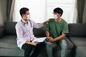 Doctor visit patients at home and follow-up the results treatment while providing confidence to patients at home during the outbreak of a new strain of coronavirus. photo