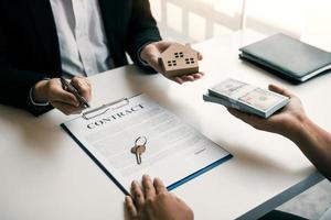 Home agents are sending pens to customers signing a contract to buy a new home. photo