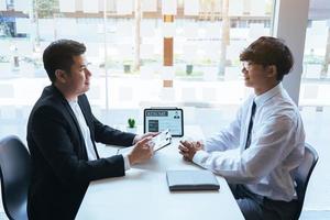 Employees are explaining about their past work experience for job interviewers. photo