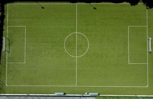 Football field with synthetic grass photo