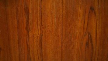 Wood grain texture for making Background or Wallpaper. Wood grain pattern, red and black tone. Red teak wood pattern. photo