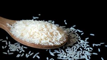 Jasmine rice, popular rice variety in Thailand. Rice grain that has passed through the polishing process Ready to be cooked or steamed. Vitamin B1 helps the body get energy from carbohydrates. photo