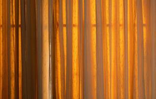 Sunshade curtains from outside the house. Wrinkles from the fabric roll for a curtain. photo