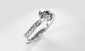 anillos de diamantes hechos de oro platino decorados con muchos pequeños diamantes colocados sobre una superficie blanca. representación 3d foto