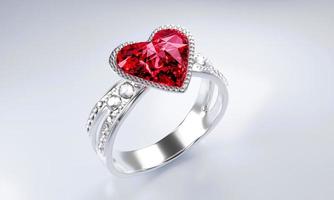 el gran diamante rojo en forma de corazón está rodeado de muchos diamantes en el anillo de oro platino colocado sobre un fondo gris. Elegante anillo de bodas con diamantes para mujer. representación 3d