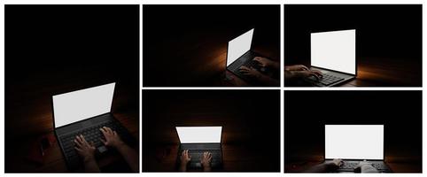 The hand of a person using a notebook or laptop, a blank screen, white, dark background, blacklight shines down on the hand. Mystery operation or hacker.3D Rendering photo