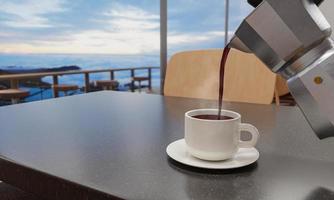 Black coffee in a white mug on a marble patterned table. The coffee shop or restaurant has a balcony overlooking the beach. Sea and beach view Blue sea and clear sky. 3D Rendering photo