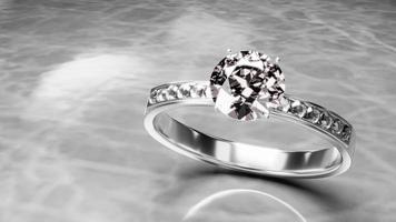el diamante grande está rodeado de muchos diamantes en el anillo de oro platino colocado sobre un fondo gris. Elegante anillo de bodas con diamantes para mujer. representación 3d foto