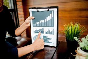 Businessman working at a computer office And graphs on his desk. Business ideas and space for copy. photo