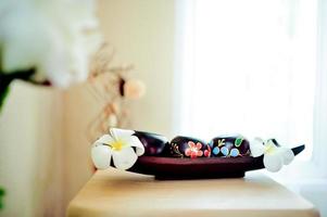 A beautiful spa element on a white fabric floor called a couch. Health Spa Equipment photo