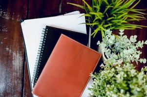 Business desk with business notebook, desk, pen, paper, table graph, top view with copy space photo