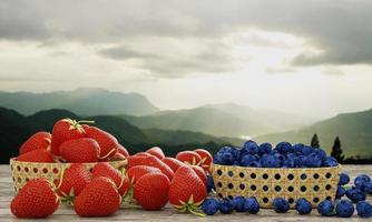 fresas y arándanos frescos en una cesta de bambú. las bayas se colocan sobre una superficie de madera. tiene un fondo de intrincados paisajes montañosos y luz solar, sol de la mañana y niebla. representación 3d foto