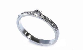 el diamante grande está rodeado de muchos diamantes en el anillo de oro platino colocado sobre un fondo gris. Elegante anillo de bodas con diamantes para mujer. representación 3d foto