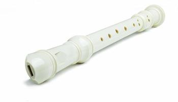 Plastic flute, universal type, off-white or pearl color. Change the tone by covering the holes with your fingers. and use your mouth to blow air out photo