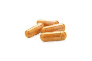 Turmeric Capsule isolated on white background with clipping path photo