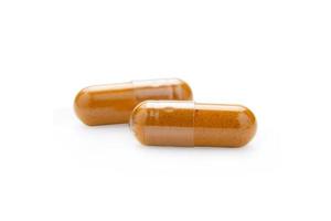 Turmeric Capsule isolated on white background with clipping path photo