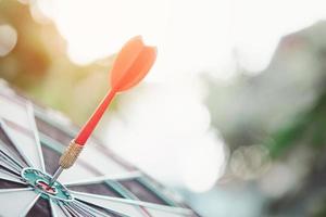 Business marketing success concept. Red dart arrow in center of the target dartboard. Bullseye is a target of business. photo