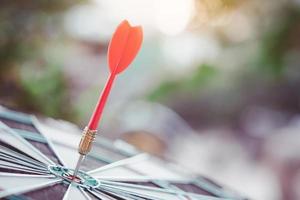 Business marketing success concept. Red dart arrow in center of the target dartboard. Bullseye is a target of business. photo