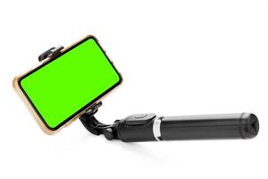 Selfie stick with smart phone isolated on white background. clipping path photo