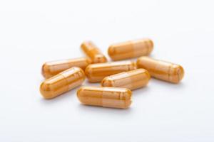 Turmeric Capsule isolated on white background photo