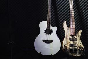 Acoustic guitar and electric bass in the studio photo