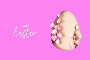 Paper cut Easter egg with cherry blossom branch.  Easter holiday concept photo