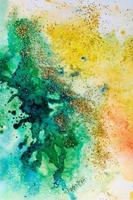 watercolor stains yellow-green with sparkles. Abstract background photo