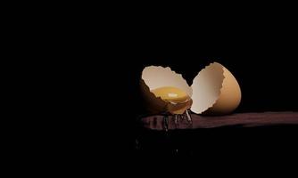 Egg yolk in a cracked  egg shell on wooden table  isolated black background. 3D Rendering. photo