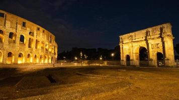 Costantine Triumph Arc and Colosseum at Night Rome Lazio Italy photo