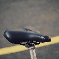 bicycle seat on the street, bicycle mode of transportation photo