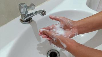 Close up women are washing their hands photo