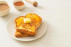 French toasted with butter and honey photo