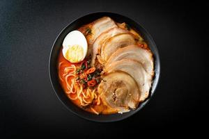 Ramen Noodles Spicy Tomyum Soup with Roast Pork photo