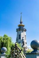 Christian church cross in high steeple tower for prayer photo