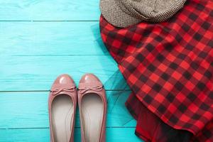 Different pairs of female shoes on blue wooden floor, Top view and copy space photo