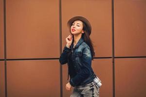 Stylish portrait of a girl in a hat photo