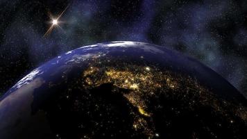 Planet Earth rotates in space from day into night and city lights turn on - Loop video