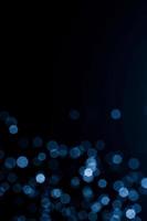 Dark blue abstract background with bokeh. Colorful twinkling lights bokeh light background. photo