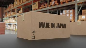 Boxes with MADE IN JAPAN text on conveyor. 3d rendering photo