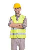 Cheerful male constructor standing with crossed arms photo