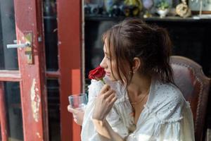 Close-up portrait of a young beautiful woman. The women looks into the frame. photo