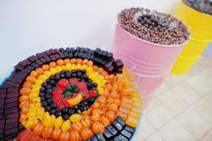 Barrels with sweets in candy shop. photo