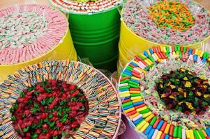 Barrels with sweets in candy shop. photo