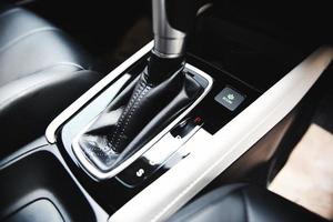 Automatic car transmission shift lever interior car detail - automatic gear and button econ mode Reducing fuel consumption photo