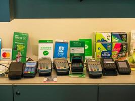 EDC machines from different online payment platforms with many sign board. Cashless society. photo