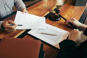 Client is bringing the documents to clarify the law to the lawyer at the prosecutor office. photo