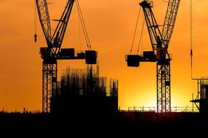 construction cranes and building silhouettes photo