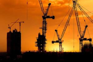 construction cranes and building silhouettes photo
