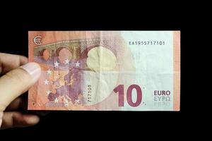 Male hand holding euro money banknotes photo