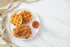 fried chicken waffle with honey or maple syrup photo